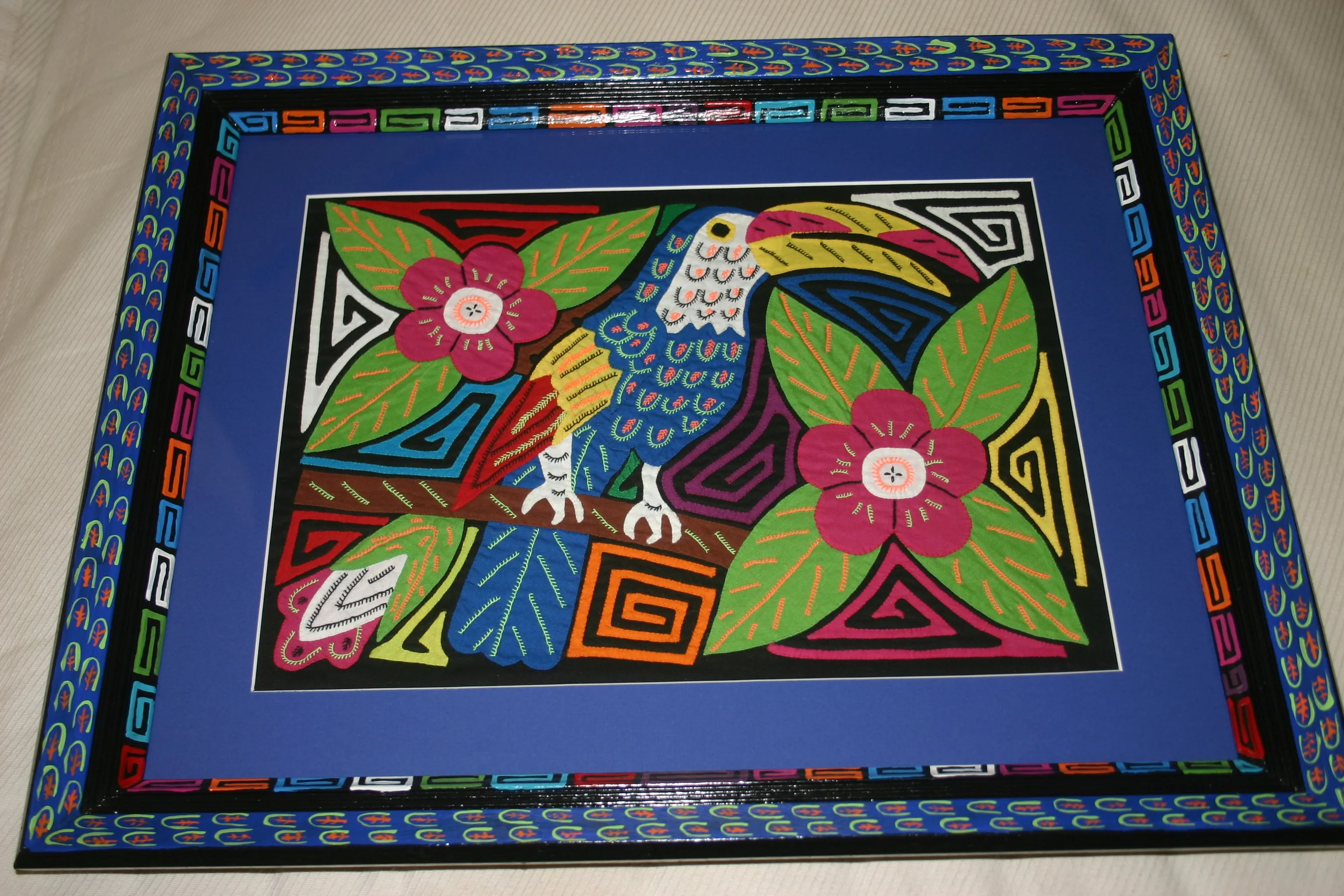 A Kuna Indian Folk Art Mola from San Blas Islands, Panama in Custom Frame, Under Glass & Double Mats. Hand Stitched Applique: Colorful Butterfly  17" X 14" (DFM1) WALL DECOR