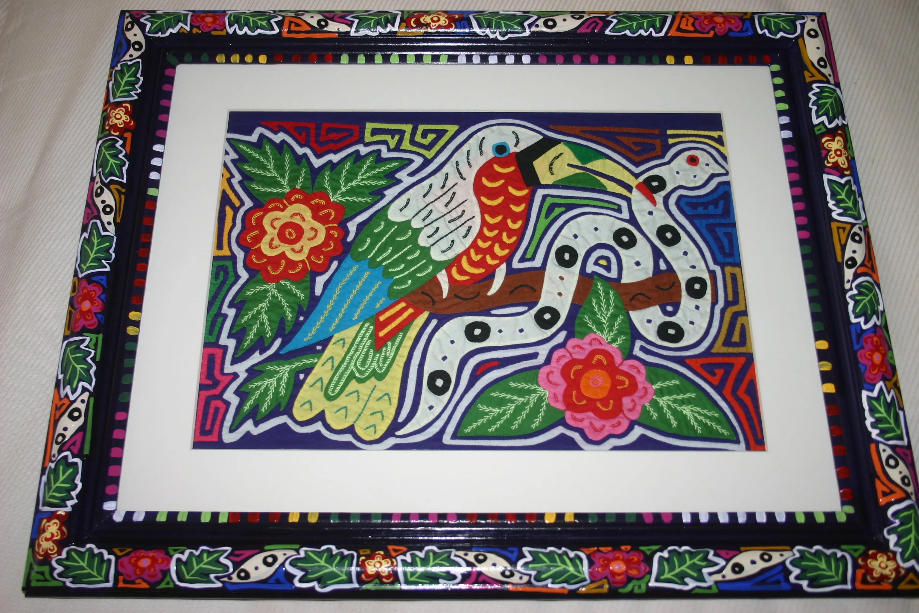 A Kuna Indian Folk Art Mola from San Blas Islands, Panama in Custom Frame, Under Glass & Double Mats. Hand Stitched Applique: Colorful Butterfly  17" X 14" (DFM1) WALL DECOR