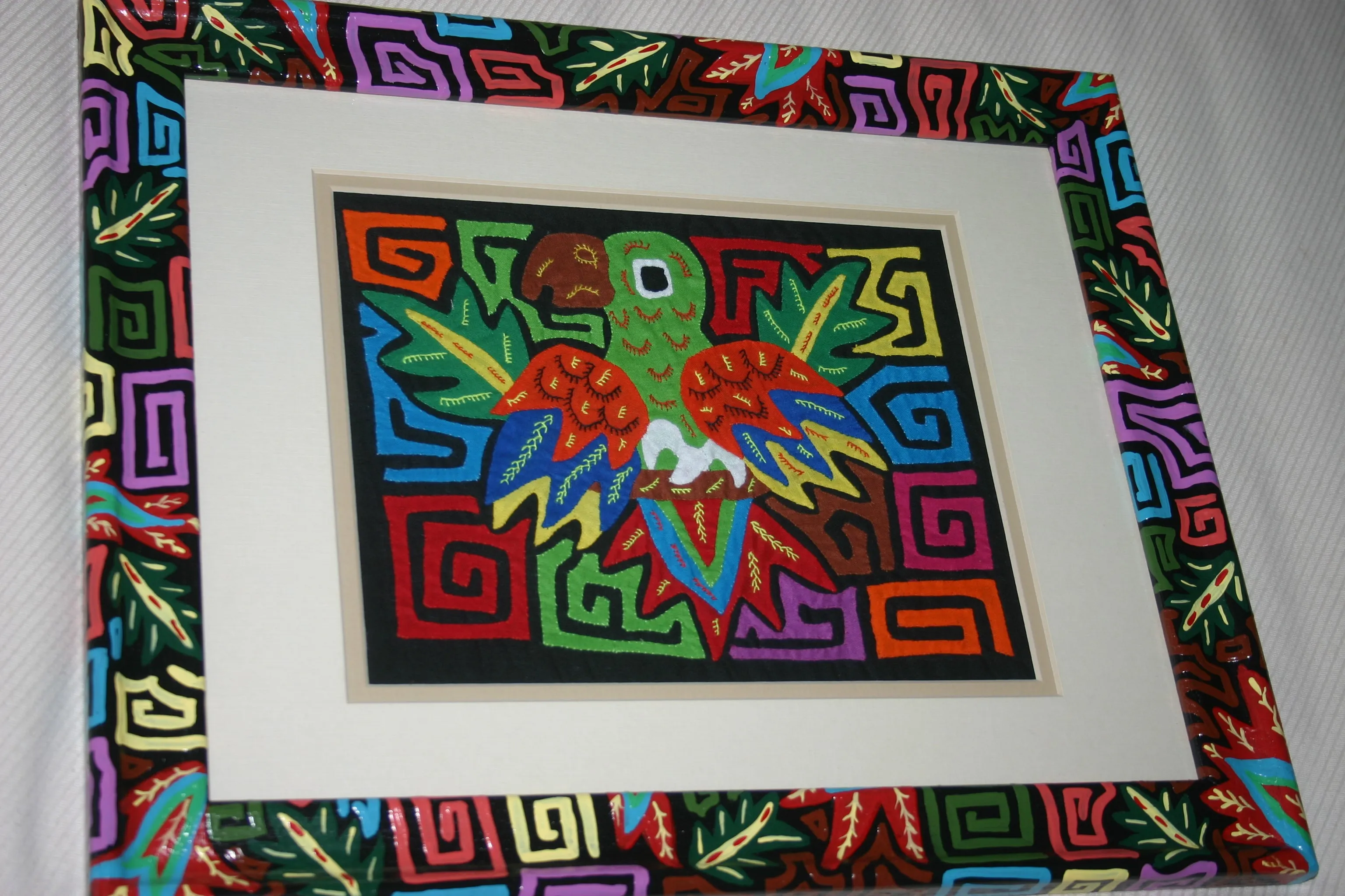 A Kuna Indian Folk Art Mola from San Blas Islands, Panama in Custom Frame, Under Glass & Double Mats. Hand Stitched Applique: Colorful Butterfly  17" X 14" (DFM1) WALL DECOR